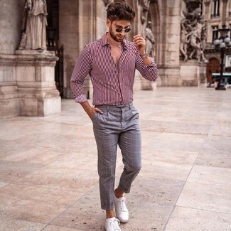 White Vertical Striped Long Sleeve Shirt Outfits For Men: In fashion situations comfort is the priority, this combination of a white vertical striped long sleeve shirt and grey check chinos is a winner. For maximum effect, introduce white canvas low top sneakers to the equation.