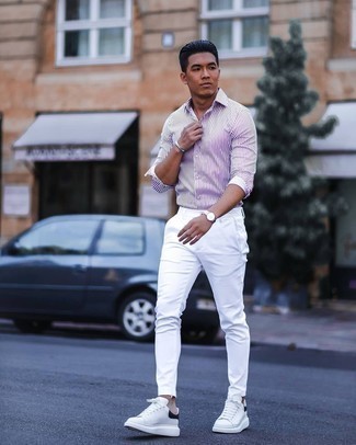 White and Black Low Top Sneakers Outfits For Men: For a look that provides functionality and dapperness, make a white and violet vertical striped long sleeve shirt and white chinos your outfit choice. On the footwear front, this outfit pairs really well with white and black low top sneakers.