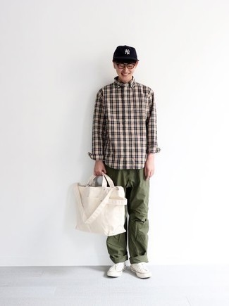 Beige Plaid Long Sleeve Shirt Outfits For Men: A beige plaid long sleeve shirt and olive chinos are a nice getup to have in your day-to-day casual fashion mix. Introduce a pair of white canvas low top sneakers to the equation and the whole ensemble will come together really well.