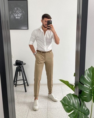 Tobacco Woven Canvas Belt Outfits For Men: This combination of a white long sleeve shirt and a tobacco woven canvas belt epitomizes comfort and versatility. Bump up this outfit by finishing with white leather low top sneakers.