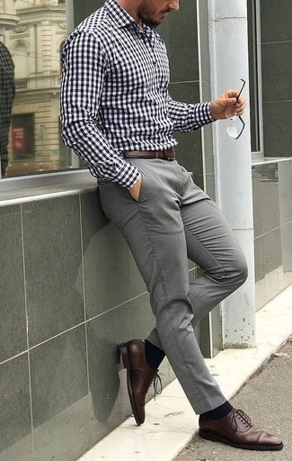 White and Navy Gingham Long Sleeve Shirt Outfits For Men: To create a casual look with a twist, try teaming a white and navy gingham long sleeve shirt with grey chinos. A pair of brown leather oxford shoes instantly spruces up the getup.
