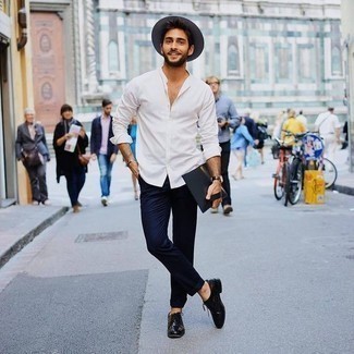 Black Leather Oxford Shoes Outfits: Wear a white long sleeve shirt with navy chinos for a casual and cool and stylish outfit. To give your overall ensemble a more elegant twist, introduce black leather oxford shoes to your outfit.