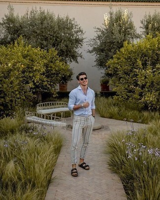 Black Leather Sandals Outfits For Men: Beyond dapper and functional, this relaxed pairing of a light blue long sleeve shirt and grey vertical striped chinos provides variety. Add black leather sandals to the mix to infuse an air of stylish effortlessness into your getup.