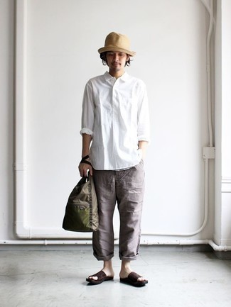 Beige Straw Hat Outfits For Men: If you're on the hunt for a casual street style yet dapper ensemble, consider teaming a white long sleeve shirt with a beige straw hat. Why not complete your outfit with dark brown suede sandals for a more casual spin?