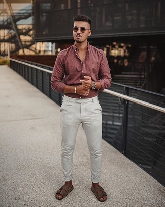 Brown Sunglasses Outfits For Men: If you're obsessed with relaxed styling when it comes to fashion, you'll love this city casual pairing of a burgundy long sleeve shirt and brown sunglasses. Give a different twist to an otherwise mostly classic getup by wearing a pair of brown suede sandals.