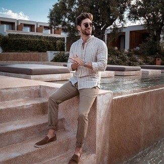 Beige Vertical Striped Long Sleeve Shirt Outfits For Men: A beige vertical striped long sleeve shirt and khaki chinos will convey this relaxed and dapper vibe. Complete your ensemble with a pair of brown suede slip-on sneakers et voila, the ensemble is complete.