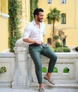 Charcoal Suede Tassel Loafers Outfits: This casual combination of a white long sleeve shirt and dark green chinos couldn't possibly come across other than seriously stylish. With shoes, go for something on the classier end of the spectrum and finish off this ensemble with charcoal suede tassel loafers.