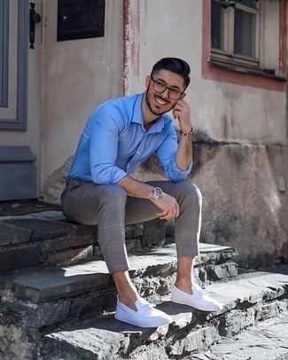 White Canvas Tassel Loafers Outfits: Go for a pared down yet casual and cool choice in a light blue long sleeve shirt and grey check chinos. Why not complement your look with white canvas tassel loafers for an added dose of refinement?