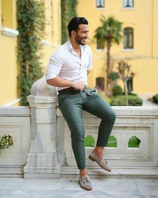 Grey Suede Loafers Outfits For Men: To don a laid-back look with a fashionable spin, make a white long sleeve shirt and dark green chinos your outfit choice. If you need to easily step up your outfit with one single item, complement this look with grey suede loafers.