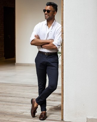 Navy Chinos Outfits: This pairing of a white long sleeve shirt and navy chinos is solid proof that a pared down casual look doesn't have to be boring. For a smarter twist, add a pair of dark brown leather tassel loafers to the mix.