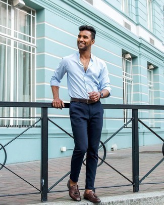 Navy Chinos Outfits: Such pieces as a light blue long sleeve shirt and navy chinos are an easy way to inject effortless cool into your daily styling lineup. Wondering how to complement this ensemble? Rock dark brown leather tassel loafers to kick it up a notch.