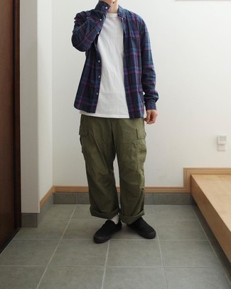 Black Canvas Slip-on Sneakers Outfits For Men: For a dapper outfit without the need to sacrifice on comfort, we love this combination of a navy plaid long sleeve shirt and olive cargo pants. Add black canvas slip-on sneakers to the equation to make the look a bit more elegant.