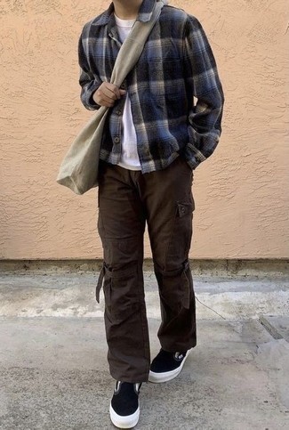 Slip-on Sneakers Outfits For Men: A navy plaid flannel long sleeve shirt looks so casually dapper when paired with dark brown cargo pants. Go the extra mile and switch up your getup by slipping into slip-on sneakers.