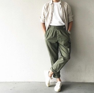 Beige Long Sleeve Shirt Outfits For Men: This relaxed casual combination of a beige long sleeve shirt and olive cargo pants is a safe bet when you need to look stylish but have no extra time. If you don't know how to finish off, a pair of white canvas low top sneakers is a tested option.