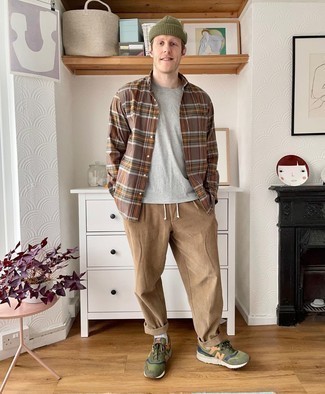 Brown Plaid Long Sleeve Shirt Outfits For Men: A brown plaid long sleeve shirt and khaki corduroy chinos are a nice combo worth having in your day-to-day routine. Finishing with a pair of olive athletic shoes is a guaranteed way to bring a touch of stylish nonchalance to this look.