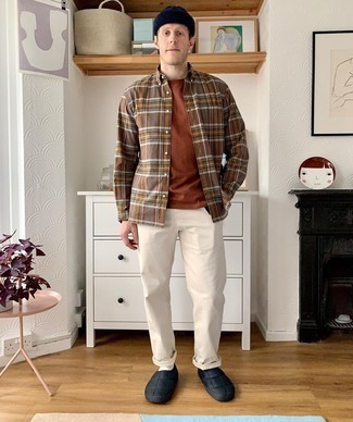 Brown Plaid Long Sleeve Shirt Outfits For Men: For a cool and casual ensemble, reach for a brown plaid long sleeve shirt and beige chinos — these pieces work beautifully together. A pair of black canvas slip-on sneakers will tie the whole thing together.