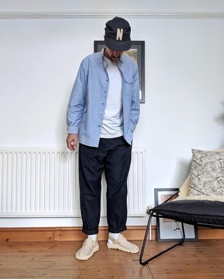 Navy and White Baseball Cap Outfits For Men: Make a light blue long sleeve shirt and a navy and white baseball cap your outfit choice to feel fully confident and look trendy. For something more on the classy end to finish this outfit, add a pair of beige canvas slip-on sneakers to the equation.