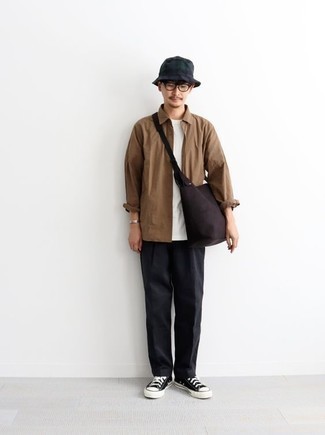 Navy Bucket Hat Outfits For Men: For an on-trend ensemble without the need to sacrifice on functionality, we love this combo of a brown long sleeve shirt and a navy bucket hat. Round off with a pair of black and white canvas low top sneakers to avoid looking too casual.