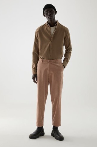 Pink Chinos Outfits: This combo of a brown long sleeve shirt and pink chinos will prove your expertise in menswear styling even on off-duty days. If you want to instantly smarten up this ensemble with a pair of shoes, finish with a pair of black leather chelsea boots.