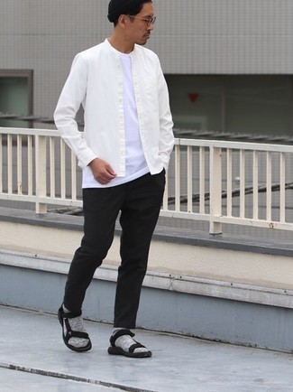 Black Canvas Sandals Outfits For Men: A white long sleeve shirt and black chinos are the kind of a tested casual ensemble that you need when you have no extra time. Kick up your whole getup by finishing with black canvas sandals.