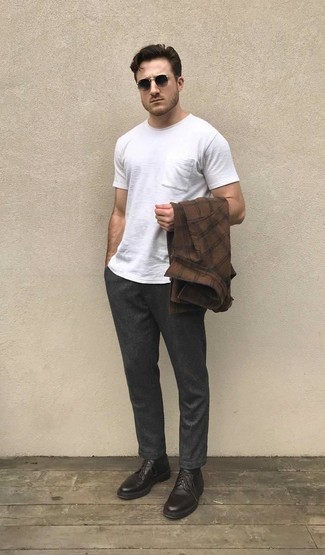 Dark Brown Plaid Long Sleeve Shirt Outfits For Men: You'll be amazed at how super easy it is for any gent to get dressed this way. Just a dark brown plaid long sleeve shirt combined with charcoal chinos. Play down the casualness of this getup by rocking dark brown leather derby shoes.