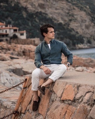 Dark Brown Suede Loafers Outfits For Men: Wear a navy long sleeve shirt and white chinos for a casually cool and trendy look. To give your overall getup a more refined aesthetic, why not complete your ensemble with dark brown suede loafers?