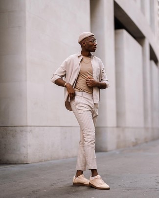 Beige Vertical Striped Chinos Outfits: If you want take your casual fashion game to a new height, try teaming a beige long sleeve shirt with beige vertical striped chinos. A pair of beige canvas low top sneakers is a savvy pick to finish your look.
