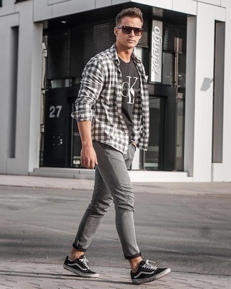 White and Black Gingham Long Sleeve Shirt Outfits For Men: A white and black gingham long sleeve shirt and grey chinos have become a go-to pairing for many sartorially savvy men. Black and white canvas low top sneakers act as the glue that will pull this ensemble together.