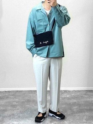 Black Canvas Messenger Bag Outfits: An aquamarine long sleeve shirt and a black canvas messenger bag are a great combination worth incorporating into your casual routine. The whole outfit comes together when you add a pair of black and white athletic shoes to your outfit.