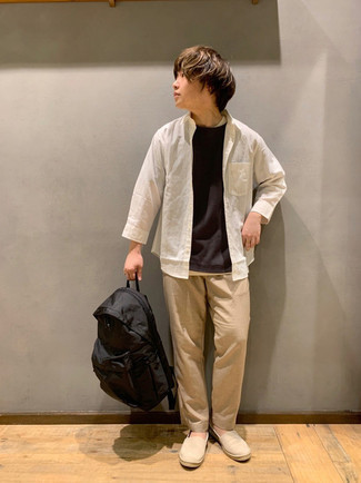 Black Nylon Backpack Outfits For Men: If you're scouting for a contemporary and at the same time on-trend outfit, pair a white long sleeve shirt with a black nylon backpack. Beige canvas espadrilles will create a beautiful contrast against the rest of the getup.