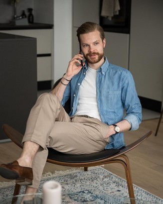Blue Chambray Long Sleeve Shirt Outfits For Men: Such essentials as a blue chambray long sleeve shirt and khaki chinos are an easy way to infuse effortless cool into your daily styling routine. Complement this ensemble with dark brown suede tassel loafers to immediately rev up the wow factor of this look.
