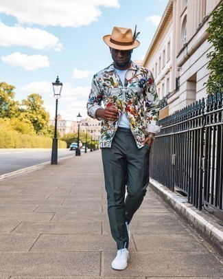 Tan Straw Hat Outfits For Men: A white print long sleeve shirt and a tan straw hat make for the ultimate casual look for today's gentleman. White canvas low top sneakers are guaranteed to infuse an extra touch of style into this look.