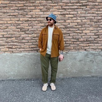 Navy Denim Bucket Hat Outfits For Men: Go for a tobacco long sleeve shirt and a navy denim bucket hat if you're on the hunt for an outfit idea for when you want to look casually stylish. Feeling brave today? Change up your look by slipping into a pair of beige canvas slip-on sneakers.