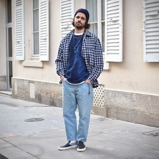Black Leather Slip-on Sneakers Outfits For Men: This casual pairing of a navy and white plaid long sleeve shirt and light blue jeans is a surefire option when you need to look laid-back and cool but have no extra time to spare. When not sure as to the footwear, stick to black leather slip-on sneakers.