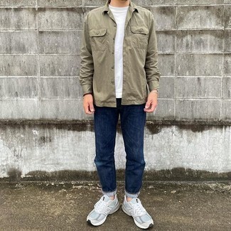 Beige Long Sleeve Shirt Outfits For Men: This combo of a beige long sleeve shirt and navy jeans is on the casual side yet it's also sharp and really sharp. A pair of grey athletic shoes immediately steps up the fashion factor of this look.