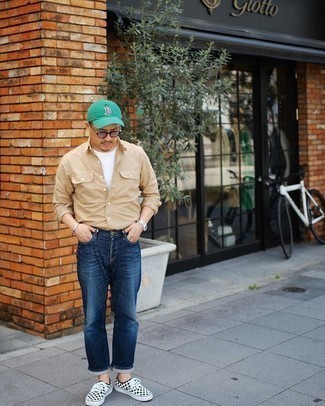 Green Baseball Cap Outfits For Men: Team a tan long sleeve shirt with a green baseball cap to get a modern casual and stylish outfit. White and black check canvas low top sneakers will immediately elevate even the most basic ensemble.