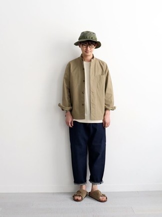 Dark Green Bucket Hat Outfits For Men: One of the best ways for a man to style a tan long sleeve shirt is to pair it with a dark green bucket hat for a casual getup. Finishing with a pair of brown suede sandals is an effortless way to add an easy-going vibe to your getup.