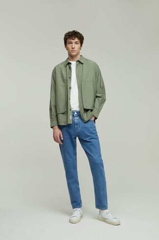 Blue Jeans Outfits For Men: For a casually cool look, consider pairing an olive long sleeve shirt with blue jeans — these two items go really well together. For maximum style effect, add a pair of white canvas low top sneakers to the equation.