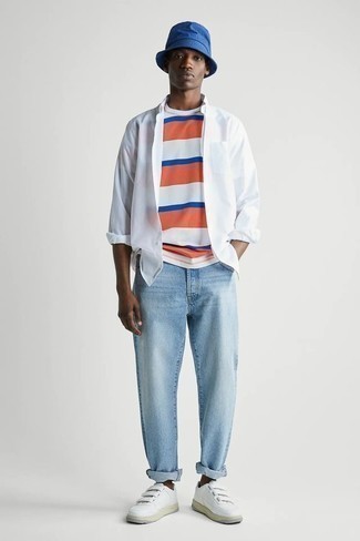 White Long Sleeve Shirt Outfits For Men: A white long sleeve shirt looks so nice when paired with light blue jeans in a laid-back menswear style. For maximum effect, complement your ensemble with a pair of white leather low top sneakers.