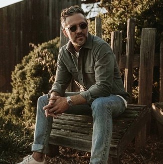 Dark Green Long Sleeve Shirt Outfits For Men: This relaxed casual pairing of a dark green long sleeve shirt and light blue jeans is a winning option when you need to look dapper but have zero time. White canvas low top sneakers look great here.