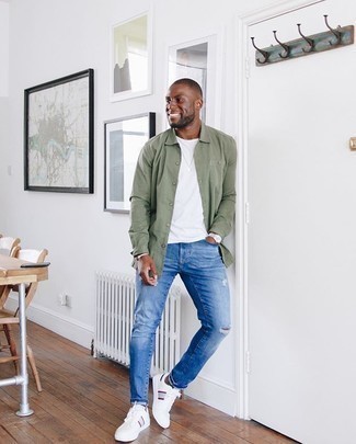 Dark Green Long Sleeve Shirt Outfits For Men: The versatility of a dark green long sleeve shirt and blue ripped jeans means you'll have them on high rotation. If you want to break out of the mold a little, complement this look with white and red canvas low top sneakers.