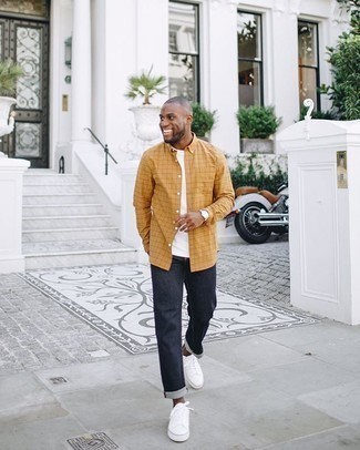 Orange Long Sleeve Shirt Outfits For Men: This casual pairing of an orange long sleeve shirt and navy jeans can go different ways depending on the way you style it. A pair of white canvas low top sneakers is a tested footwear style here that's full of personality.
