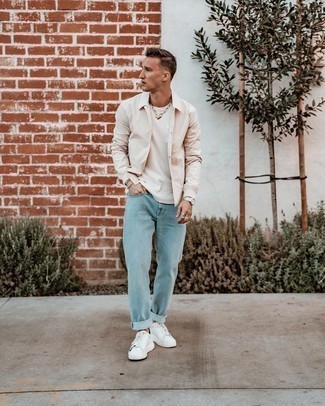 Beige Long Sleeve Shirt Outfits For Men: This combination of a beige long sleeve shirt and light blue jeans is great for casual situations. If you don't know how to finish, a pair of white leather low top sneakers is a foolproof option.