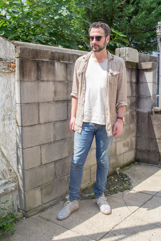 Tan Long Sleeve Shirt Outfits For Men: This off-duty combination of a tan long sleeve shirt and blue ripped jeans is clean, seriously stylish and very easy to imitate. White print leather high top sneakers tie the getup together.