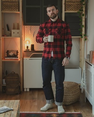 Black Jeans Outfits For Men: Consider wearing a red and black gingham long sleeve shirt and black jeans for both seriously stylish and easy-to-wear look. Not sure how to round off? Introduce white canvas high top sneakers to this look to shake things up.