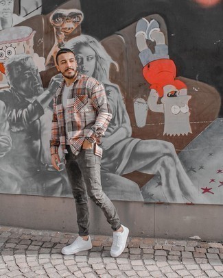 Charcoal Ripped Jeans Outfits For Men: Team a multi colored plaid flannel long sleeve shirt with charcoal ripped jeans to put together a really sharp and edgy ensemble. If you want to break out of the mold a little, opt for a pair of white leather low top sneakers.