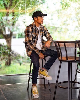 Multi colored Print Socks Outfits For Men: Wear a multi colored plaid flannel long sleeve shirt with multi colored print socks to be both laid-back and dapper. Balance out your ensemble with a dressier kind of shoes, like this pair of mustard canvas low top sneakers.
