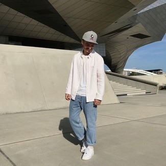 Grey Print Baseball Cap Outfits For Men: A white long sleeve shirt and a grey print baseball cap are an essential off-duty combination for many fashion-savvy gents. Get a little creative when it comes to footwear and smarten up this ensemble with white canvas low top sneakers.