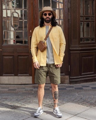 Brown Leather Fanny Pack Outfits For Men: A yellow long sleeve shirt and a brown leather fanny pack worn together are a match made in heaven for those dressers who appreciate relaxed casual styles. If you're hesitant about how to finish, a pair of grey athletic shoes is a savvy choice.