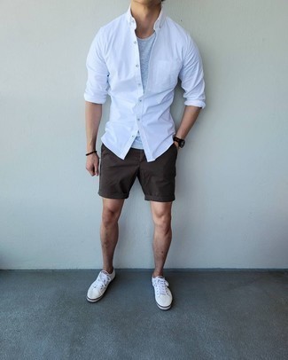 White Long Sleeve Shirt Outfits For Men: The combo of a white long sleeve shirt and dark brown shorts makes this a solid casual look. Complete this ensemble with white canvas low top sneakers and the whole ensemble will come together.